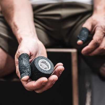 Athlete using Murgs Crossfit Thumb tape