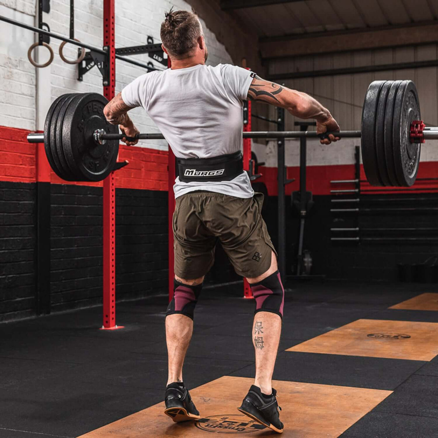 Male athlete performing snatch in a 5 inch Murgs nylon belt